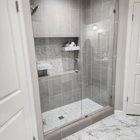 walk in shower remodel, custom shower niche, marble flooring