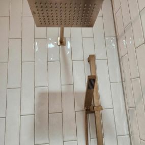 dual shower head remodel with subway tile