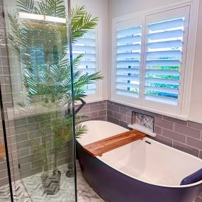 bathroom remodel free standing blue tub, marble floors