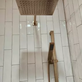 dual shower head remodel with subway tile