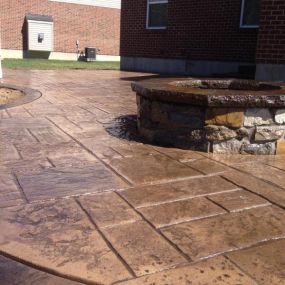 Real Stone Fire Pit sitting on a Stamped Concrete Patio in Mason Ohio 45150