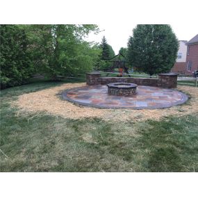 Circular Stamped Concrete Patio with Stone Fire Pit and Seating Wall and Columns Maineville Ohio 45039