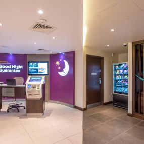 Premier Inn reception with check in desk and kiosks