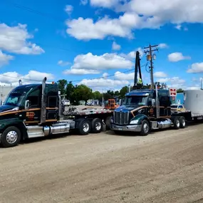 Two Morrell Transfer semi-trucks are working together