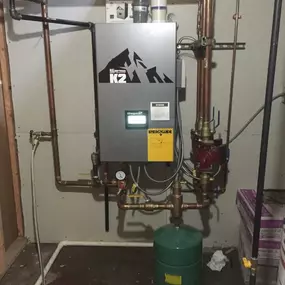 We repiped but reused all of the existing cast iron radiators in the 150 year old house. The picture is of the K2 Burnham 95% Boiler. We have always worked on boilers and redesigned them. They are a lot more common in older homes.