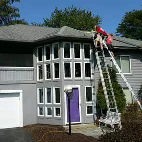 Gutter Installation on summer day.