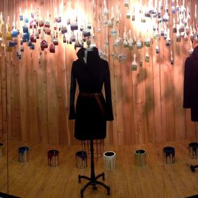 A Fashion Merchandising student installed the Migration Window for the Visual Merchandising III class.