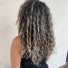 Long Thick Curly Hair, Cool Tone Balayage, at Uniquely Elegant Hair Salon in Albuquerque Abq