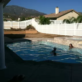 Happy customers enjoying their new construction pool