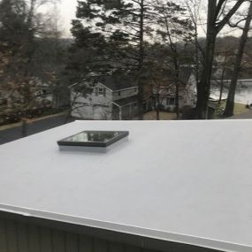 New Velux skylight on a TPO flat roof.