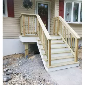 Completed Job in Andover, NJ. Both the decking and the railing system were replaced on this front porch with pressured treated wood. White PVC trim board was also added on the trim and the risers to top off this job!