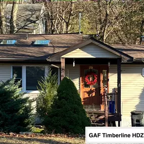 Completed Job in Sussex, NJ. This little lake house roof had both skylights replaced with new Velux skylights and was re-done in GAF Timberline HDZ - Hickory Shingles