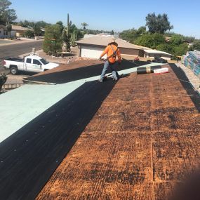 Installing a new shingle roofing on a home in Mesa.