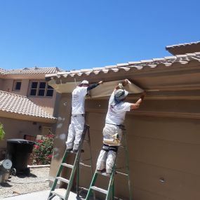 Two of our guys preparing a Phoenix house for exterior painting.