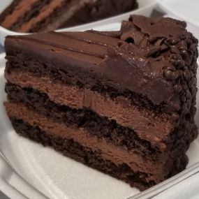Triple layer Chocolate Mousse Elite is a chocolate lovers dream! Dense chocolate cake with thick layers of chocolate mousse icing in between!