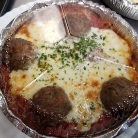 Keep it classic with our traditional Spaghetti and Meatballs pasta dinner smothered in mozzarella cheese! Also included is a fresh garlic bread stick and a crisp side salad!