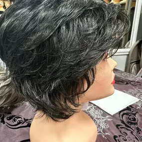 Wig of the Week: This striking salt and pepper wig color captures the natural arrival of silver strands: a dark base sprinkled with luminous white. Find this shade in more than 20 popular styles!