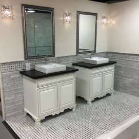 Unique bathroom vanities with modern sinks and custom tile work. Featured in our Phoenix showroom.