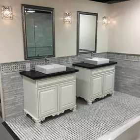 Unique bathroom vanities with modern sinks and custom tile work. Featured in our Phoenix showroom.