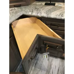 Unique corner cabinet drawer.