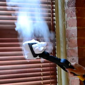 Steam cleaning blinds.