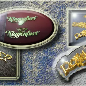 Abzeichen, Logos, Embleme, Pins, ...: 
gefräste Schriftzüge und Logos. Diese wurden direkt aus einem Goldblech erhaben ausgefräst und zu Ansteckern, Pins, .... weiterverarbeitet