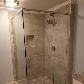 Looking to enhance the aesthetic of your bathroom? Try a frameless shower!