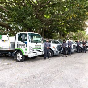 The Protective Pest Control Staff with their Trucks