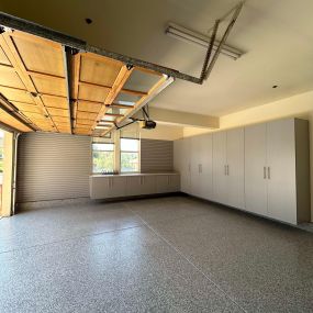 Silver Cabinets, Slatwall & Epoxy Flooring by Premier Garage of the Bay Area
