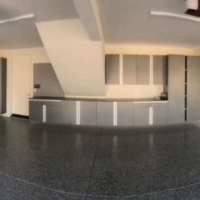 Custom cabinets, countertop, slatwall and epoxy flooring by Premier Garage