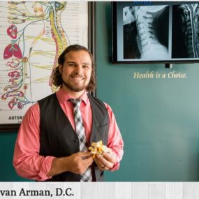 Chiropractor, Dr. Devan Arman, provides specific chiropractic adjustments.