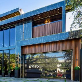 Check out this ultra-modern hurricane impact-resistant glass garage door installed by ACG.