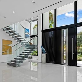 ACG installed impact-resistant windows, contemporary doors, and glass railings in this incredible modern home.