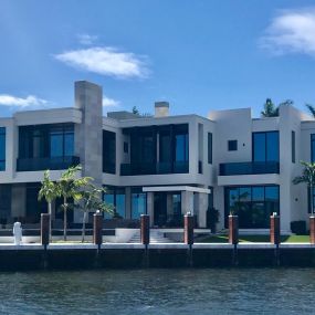 Contemporary water front home with impact resistant windows and doors.