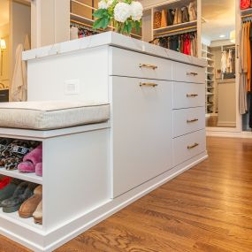 Incredible luxe closet in McLean features stunning center island.