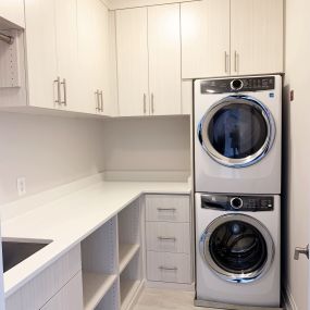 Gorgeous and well-organized laundry room with plenty of storage.