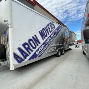Aaron Movers trailer next to UHAUL trailer
