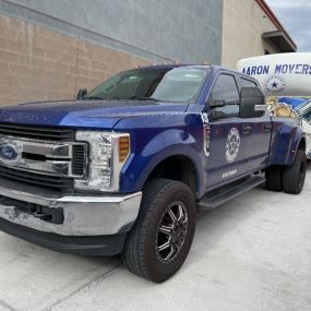 Aaron Movers truck outside of a storage facility.