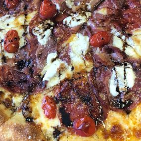 Come try our Northwood Pizza. Fresh mozzarella, salami, pepperoni, capicola, prosciutto, cherry tomatoes and a drizzle of balsamic reduction. Sweet and spicy. Yummy!