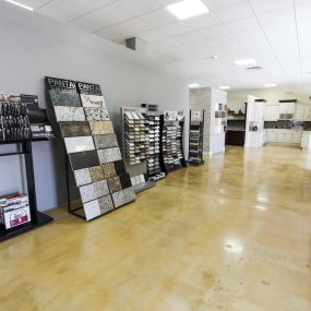 Stone International showroom with granite and quartz slabs.