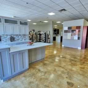 Stone International showroom with off-white cabinets and countertop.
