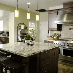 Kitchen with espresso shaker cabinets and granite countertop.