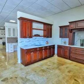 Stone International showroom with cherry double shaker cabinets and quartz countertop.