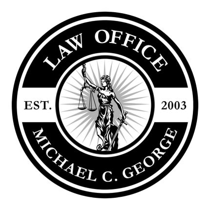 Logotyp från Law Office of Michael C. George, PA