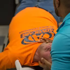 Dr. Bailey using his chiropractic techniques on a patient at Spine in Motion Chiropractic Rehab