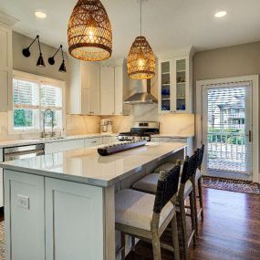 Moving the refrigerator into the pantry improved useful space and style in this Wrightsville Beach kitchen