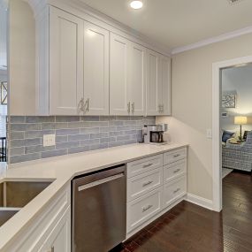 Shaker white kitchen with blue subway backsplash