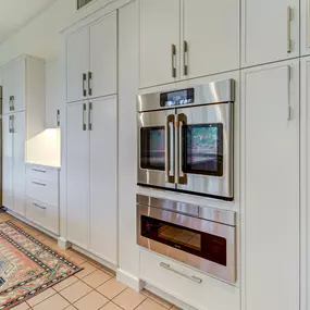 Modern Kitchen in Landfall with Slim Shaker frameless Showplace EVO cabinets- white built-in pantry cabinets with roll trays for extra storage