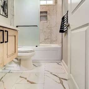 A floating vanity made a small bathroom in Leland look larger.