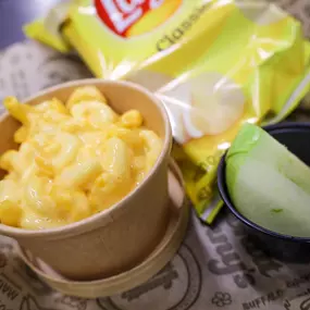 Can include Mac & Cheese cup, side of chips and a sliced apple.